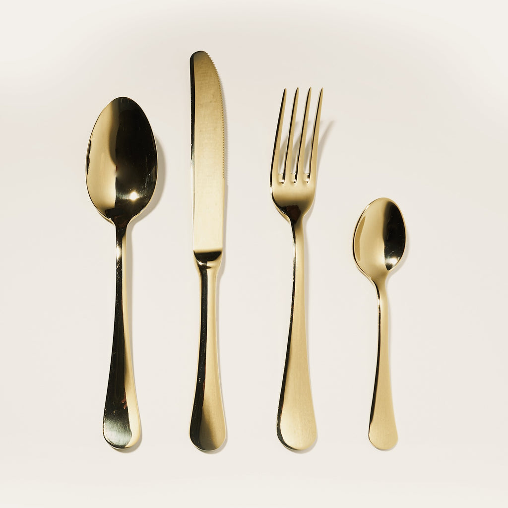 Polished gold cutlery