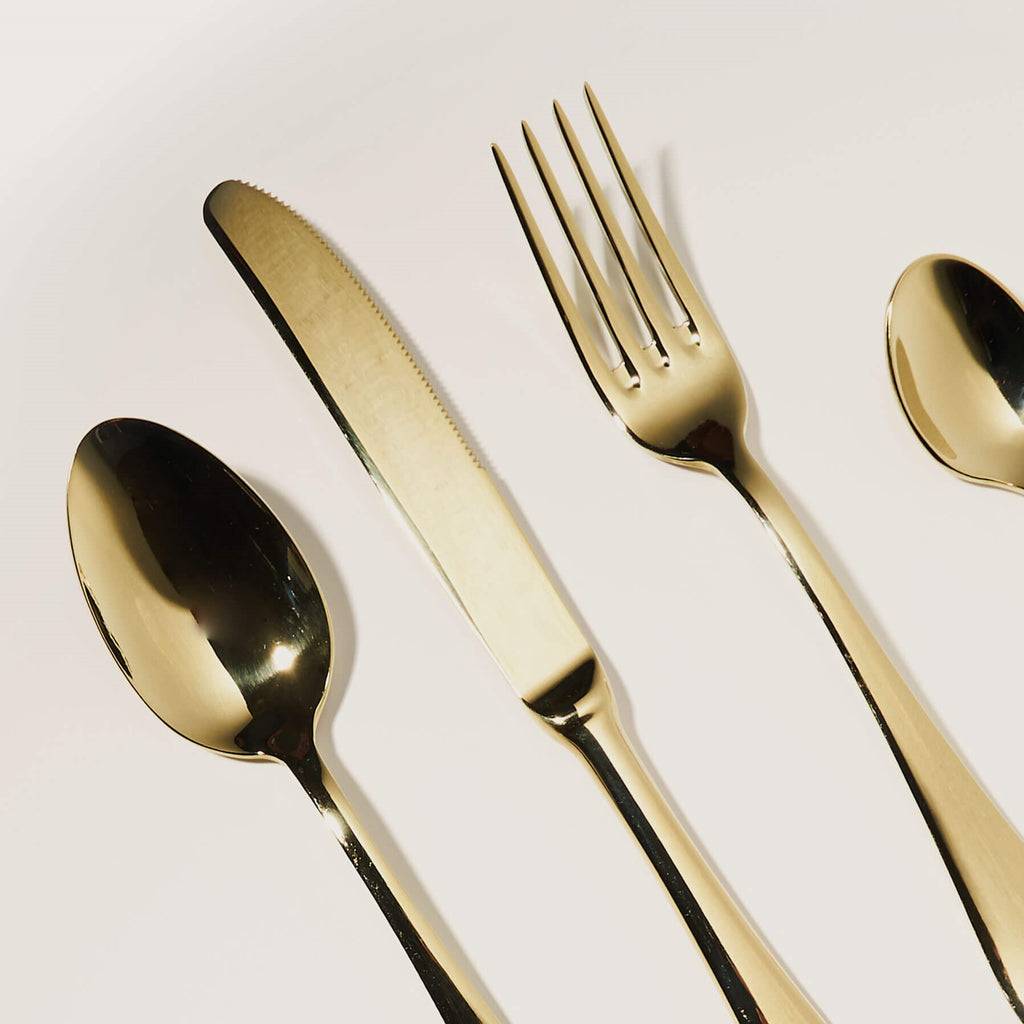 Polished gold cutlery